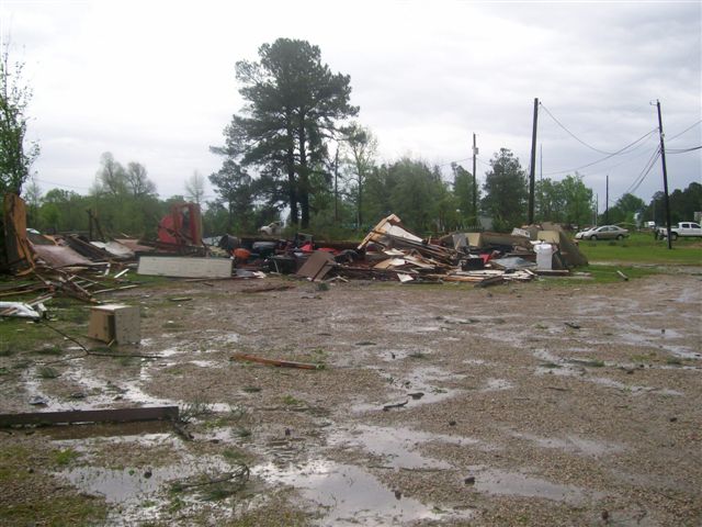 Debris pushed into dirt field during the storm.